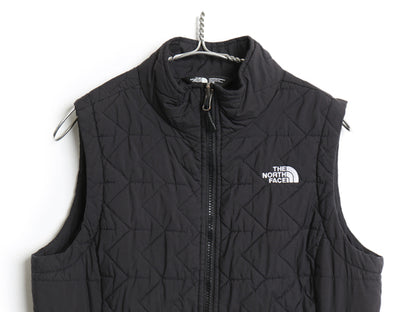 ノースフェイス 中綿 ナイロン ベスト レディース M アウトドア 重ね着 前開き フルジップ ハイネック キルティング ワンポイント ブラック