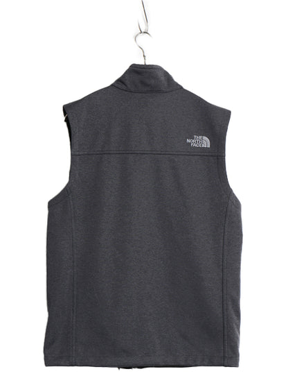 US企画 ノースフェイス ソフトシェル ベスト メンズ S アウトドア フルジップ ストレッチ 重ね着 前開き ハイネック ワンポイント 企業 灰