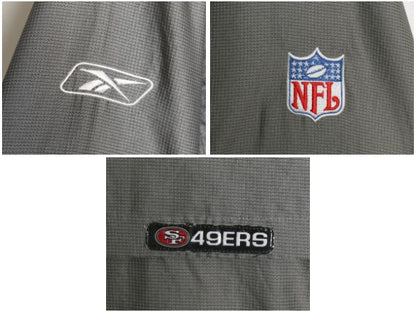 49ers ナイロン トラック ジャケット メンズ M / NFL オフィシャル リーボック フルジップ ウィンドブレーカー アメフト メッシュ ライナー